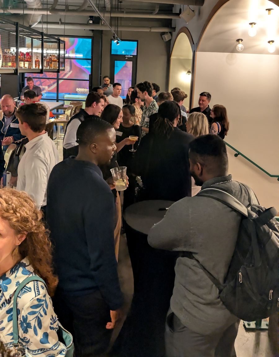 Connect Cincy attendees mingling with drinks at the Moxy Hotel in downtown Cincinnati